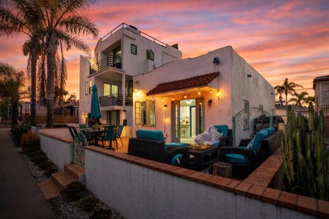 Welcome to your coastal retreat! A charming exterior with a spacious private patio. (Main House)
