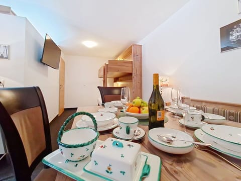Interior Design, Furniture, Ceiling, Room, Kitchen & Dining Room Table, Dining Room, Chair, Dishware, Countertop, Houseplant