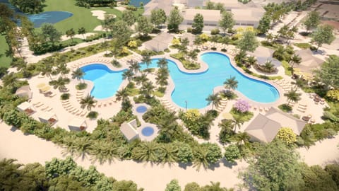 Explore the expansive resort pool complex from above in daylight.