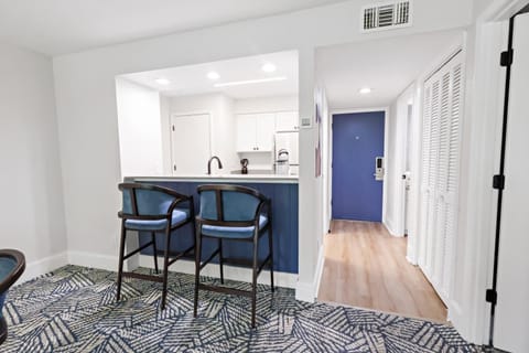 Start your day with coffee at the sleek breakfast bar.