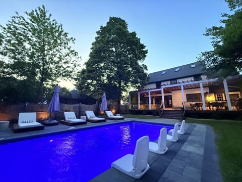 Resort-style backyard with private heatedpool and outdoor living space