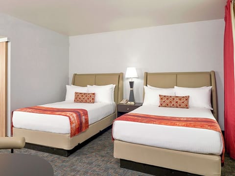 Stretch out on crisp linens for a restful night’s sleep.