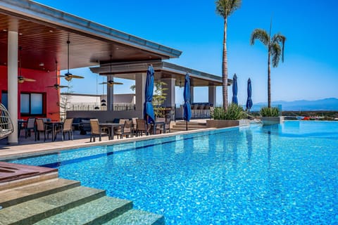 Relax in the stunning rooftop infinity pool while enjoying panoramic views, sunshine, and a true resort-style atmosphere.