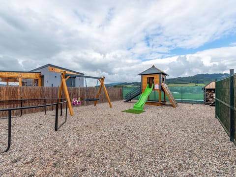 Sky, Landscape, Cloud, Land Lot, Outdoor Play Equipment, Shade, Fence, Park, Meteorological Phenomenon, Playground Slide