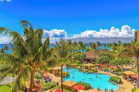 This is your view, lush palms, sparkling pools, and endless blue horizon HKH-409