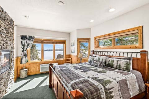Spacious king bedroom with plush comfort and beautiful lake views right from the window.