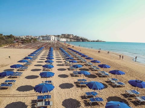 Private beach, white sand, sun loungers, beach umbrellas
