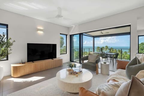 Relax into a light-filled living space where designer furnishings and uninterrupted ocean views set the tone.