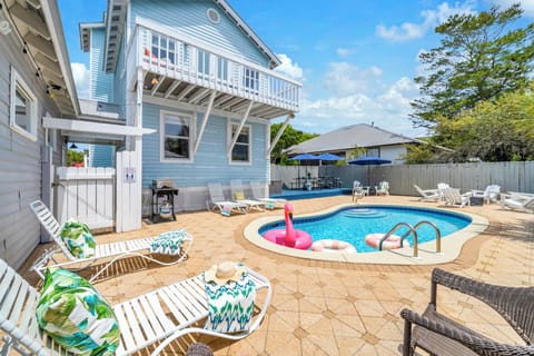 Your private poolside paradise awaits with sparkling water, comfortable loungers, and plenty of space to soak up the sun.