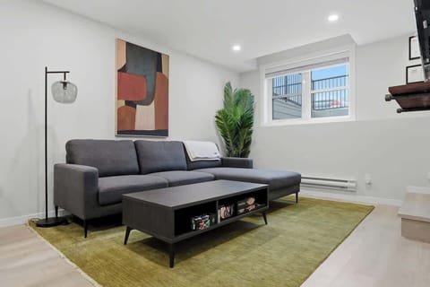 Living room with sectional and coffee table.