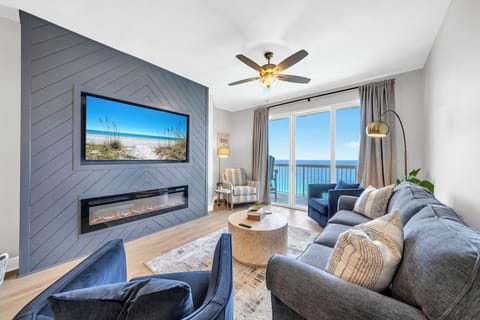 Nights are cozy around this electric fireplace & 65" smart TV paired with that breathtaking view!