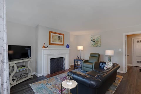Luxury Living Room w/ Leather Sofa, Reclining Chair, and TV