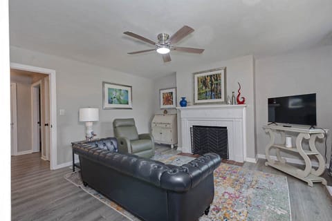 Comfortable Living Area with Decorative Artwork and TV