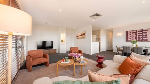 Spacious open plan living area designed for comfort, with multiple seating zones and natural flow