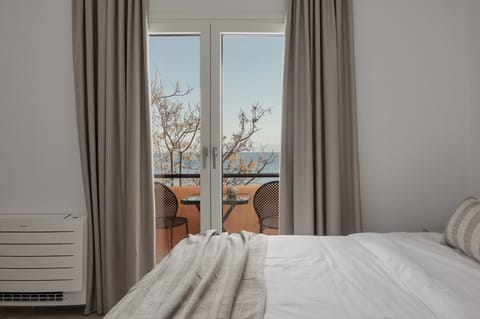 Superior Room, Balcony, Partial Sea View | In-room safe, iron/ironing board, free WiFi