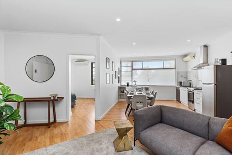 The heart of the home: A sprawling, light-filled open-plan layout that connects the stylish living area, dining zone, and modern kitchen for seamless group living.