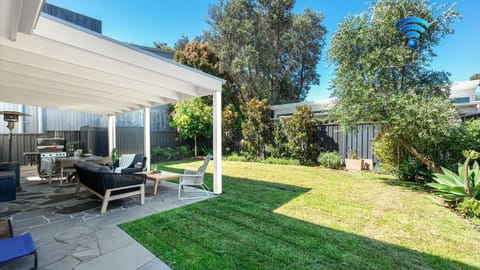 Sunshine Retreat | Covered al fresco dining | Outdoor lounge | BBQ | Gas heater | Outdoor shower