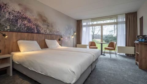 Relax into plush beds with garden views and soft lighting.