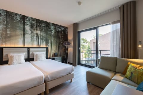 Breathe in balcony light from a serene, designer-styled bedroom.