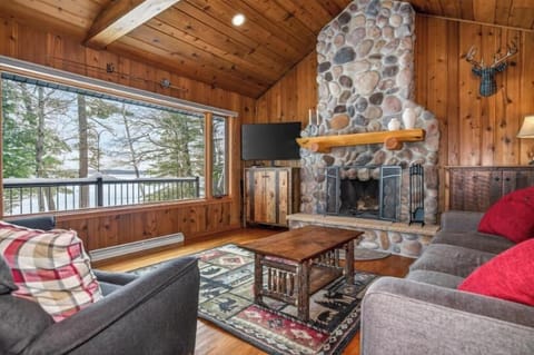Beautiful living area with a wood burning fireplace.