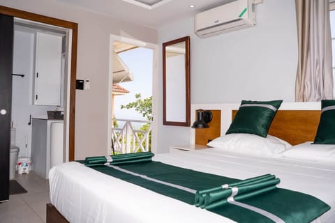 Wake to mountain views — king suite opens to private balcony & en-suite bath