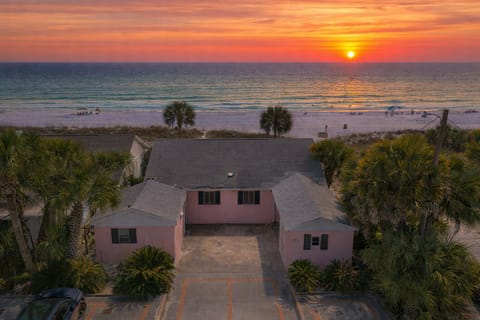 Charming beach cottage steps from the sand, with palm‑lined views and unforgettable sunset skies.