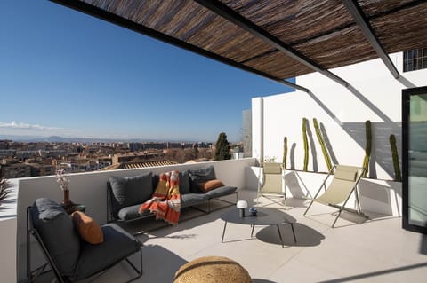 Private terrace with stunning city and mountain views, perfect for relaxation