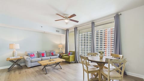 Living and dining areas with direct access to balcony via sliding glass door