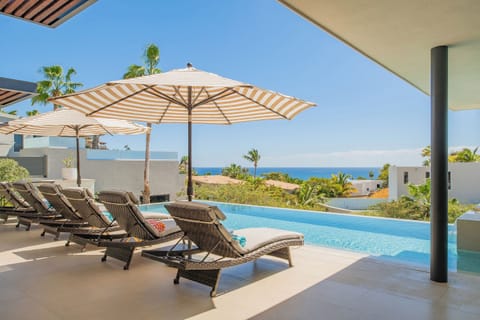 Soak up the tropical paradise from your private infinity pool terrace, where ocean views and swaying palms create the perfect retreat.
