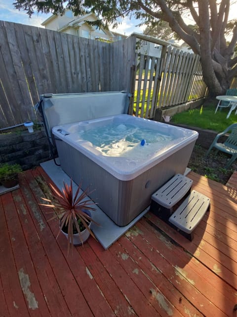 Unwind in your private hot tub on the wooden deck, surrounded by mature trees and complete privacy for the perfect evening soak.