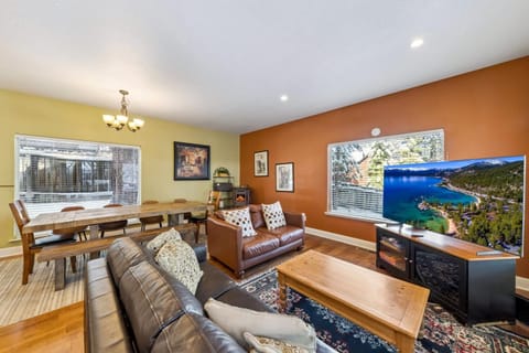 Cozy living and dining area with vibrant warm tones