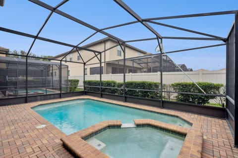 Secluded screened pool and spa area for ultimate relaxation
