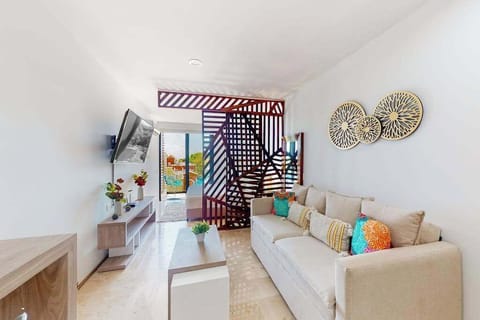 Studio living area with sofa and smart TV