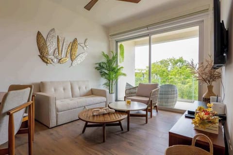 Living room opening to a private balcony