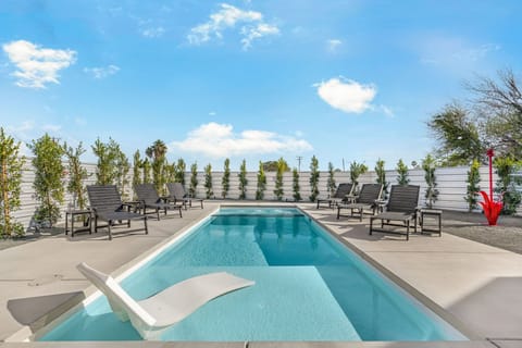 Private pool with lounge chairs and sunny relaxation space