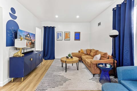 Kick back in this cozy corner with warm wood accents and playful decor, a comfortable spot for coffee, conversation, or a little downtime.