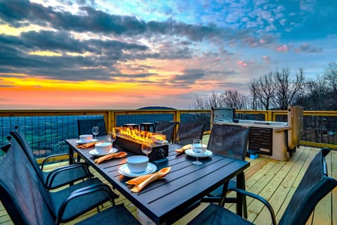 Firepit table to set the mood, complete with a sweeping sky showing off its golden rays as your background!