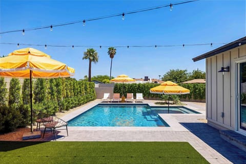 Resort-style pool perfect for a luxe desert getaway, with plenty of space to swim, lounge, and relax outdoors. A sunny backyard setup that makes it easy to enjoy the Scottsdale weather.