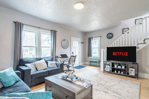 [Main floor, living room] Bright, open living room with comfy seating and TV