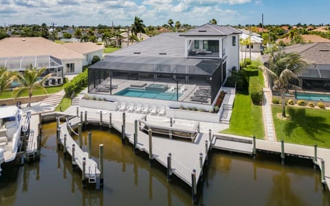 Private waterfront retreat featuring a heated pool, spa, expansive dock, and direct Gulf access.