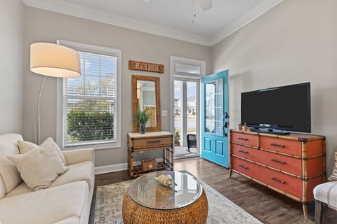 Coastal living room with cozy ambiance and light-filled space.