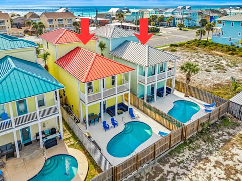 These two homes sit side by side, creating the perfect setup for large groups or multi‑family vacations.