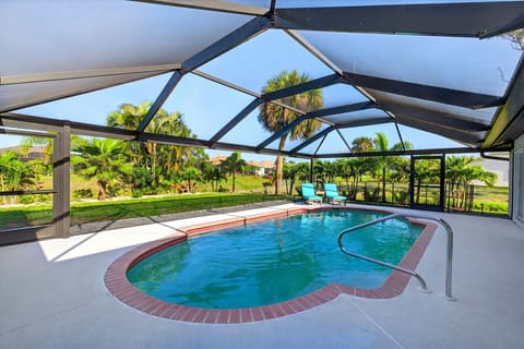 Screened in pool area with covered patio