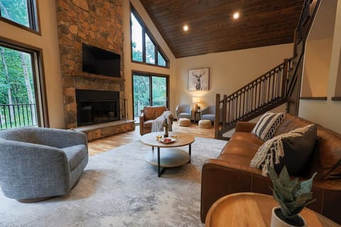 Open-concept great room with wood burning fireplace - designed for gathering and relaxing together