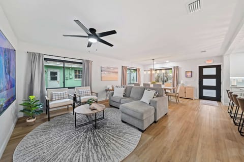 Open-concept living and dining area with modern furnishings and natural light.
