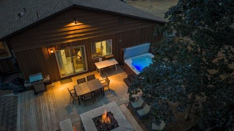 Backyard with Hot Tub and Fire Pit - Step outside to enjoy the large enclosed yard, ideal for soaking in the hot tub, grilling, or enjoying evenings by the fire pit.