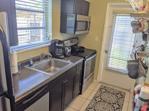 Kitchen: Bathed in natural light, this morning nook is the perfect place to start your day with a quiet espresso.