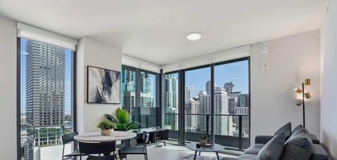 Floor-to-ceiling windows fill the space with light.