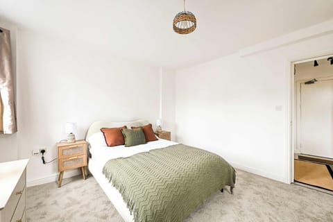 Serene Bedroom Retreat: Enjoy bright sunlight and stylish decor for a perfect restful stay!