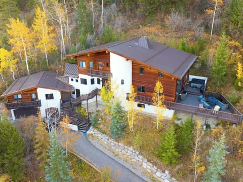 Exterior view of the home in a grove of aspen trees.